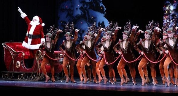 Radio City Christmas Spectacular | New York City, NY Santa Claus and The Rockettes line the stage at Radio City Music Hall. | Photo from Radio City Christmas Spectacular