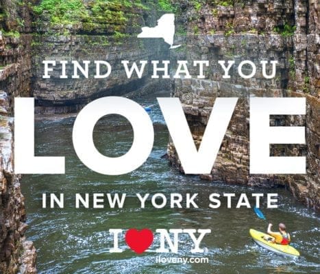 Kayaker on a river surrounded by lush green cliffs, with bold text overlay: Find What You Love in New York State. A red heart icon represents I Love NY with a website link.